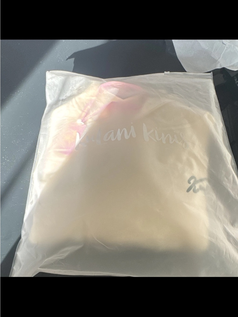 Kulani Kinis cream sweater with pink accent
